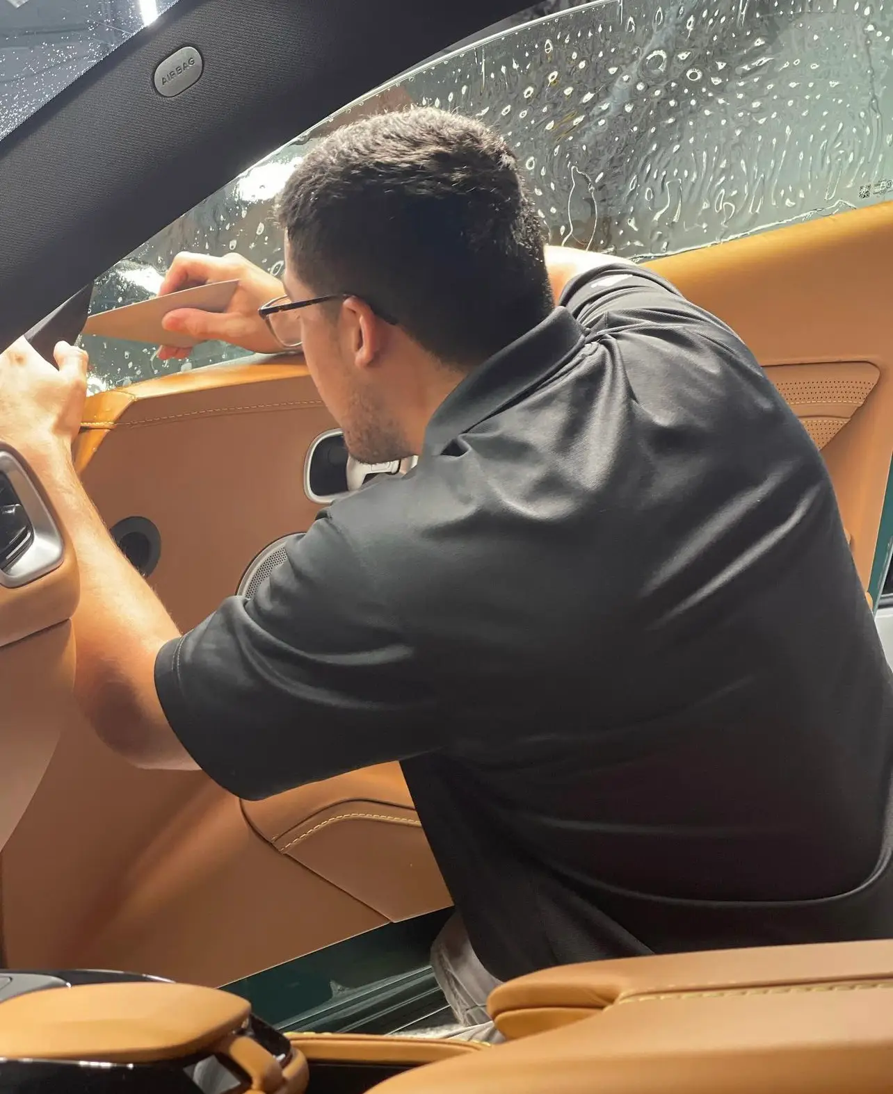 Picture of technician installing window tint. Buffalo Grove Window Tint