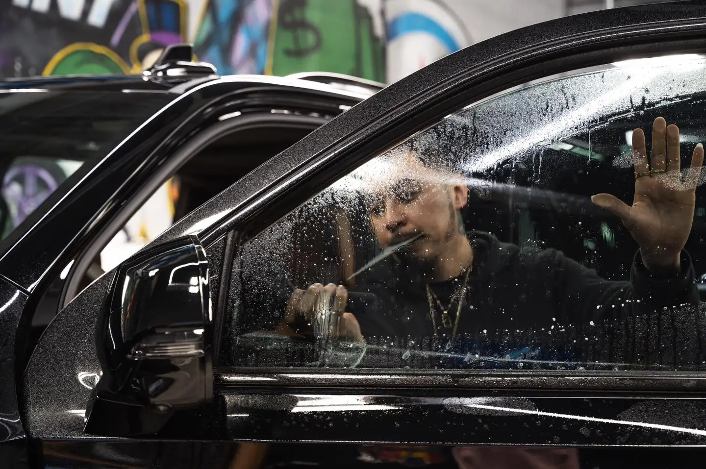 picture of an SUV front window being tinted at Exotic Window Tint near Chicago