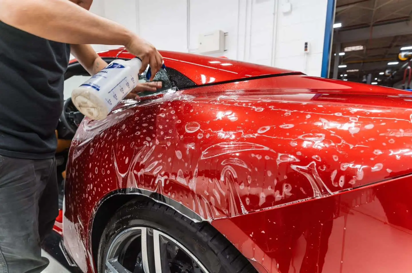 Picture of red Ferrari Portofino during paint protection film install by Exotic Window Tint in Wheeling, IL