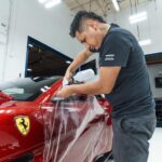 Picture of red Ferrari Portofino during paint protection film install.
