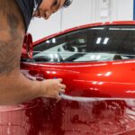 Picture of red Ferrari Portofino during paint protection film install.