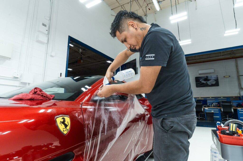 Picture of red Ferrari getting paint protection film