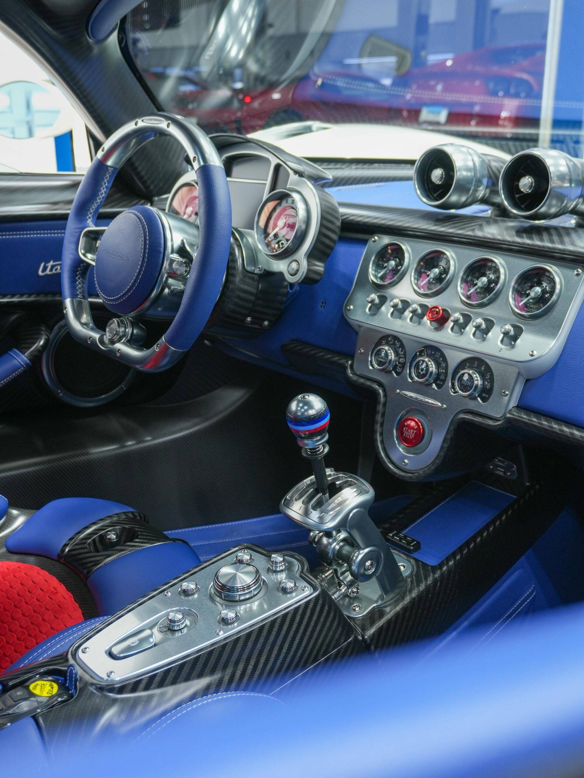 Stunning blue leather and machined metal interior of the Pagani Utopia