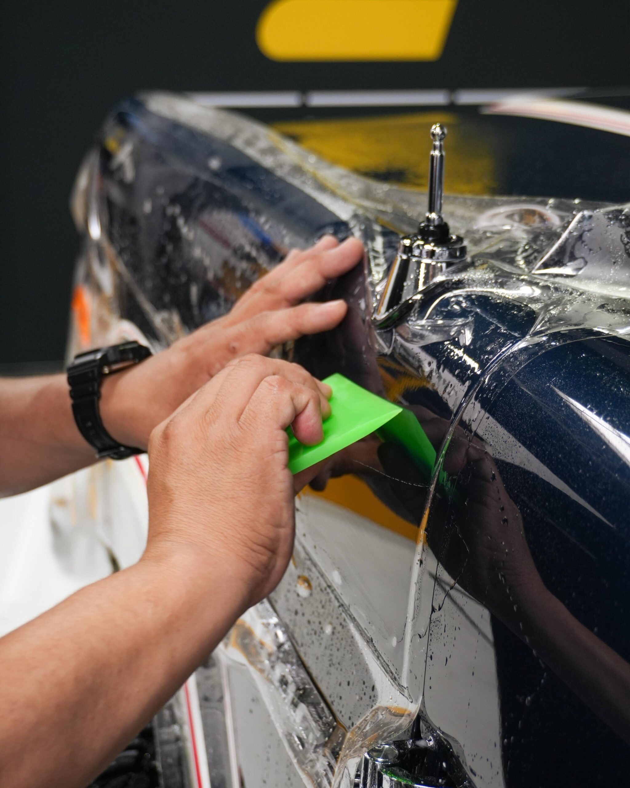 Squeegee application of paint protection film locking out air and moisture near Northbrook