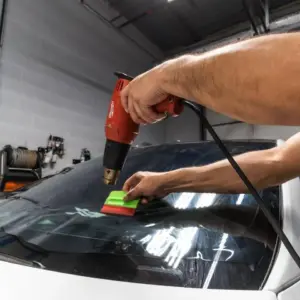 Picture of technician installing window tint